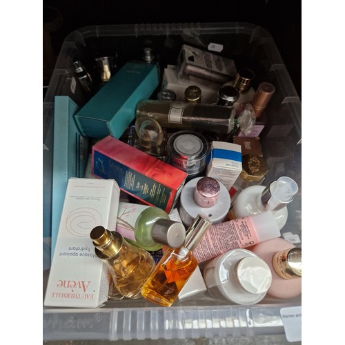 80 - A box of perfumes and beauty products