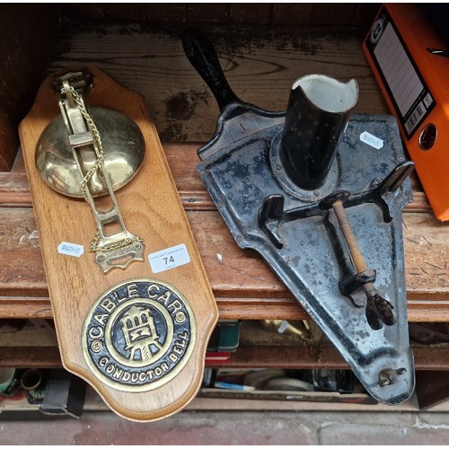 74 - A San Francisco cable car conductor's bell, stamped 'SFC.Co', mounted on board, together with an ant... 