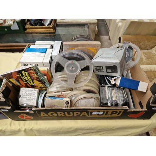 99 - A box of assorted items including 8mm cine films, reel to reel tapes and a small box of glass photo ... 