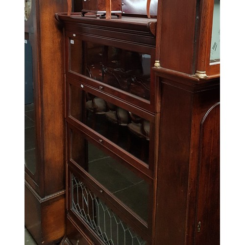 903 - A mahogany sectional bookcase.