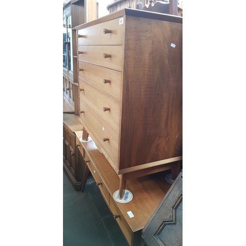 901 - A mid 20th century walnut dressing table and matching chest of drawers by Alfred Cox.