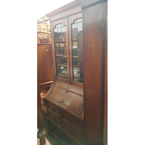 902 - A 1920s oak bureau bookcase.