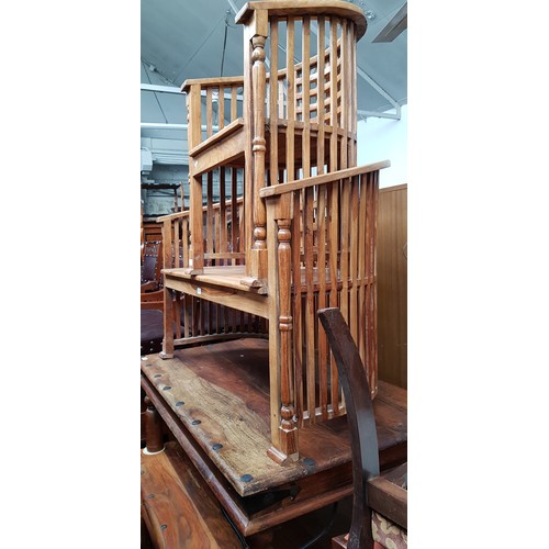 907 - A hardwood two seater bench and a pair of matching tub chairs.