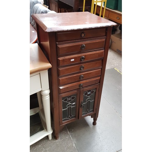 944 - An early 20th century mahogany and leaded glass music cabinet.