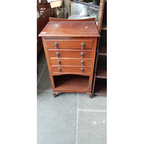 932 - An early 20th century mahogany music cabinet.