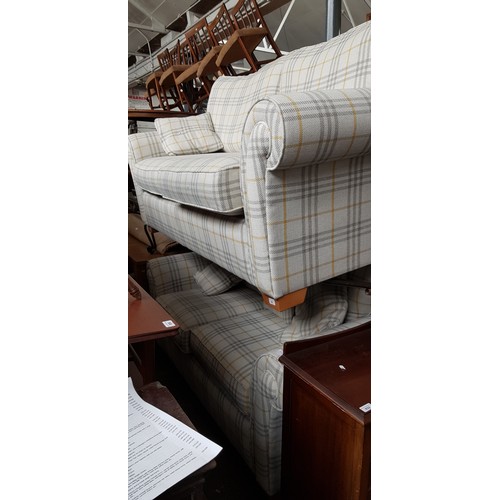 931 - A pair of John Lewis sofas with cream and yellow plaid upholstery.