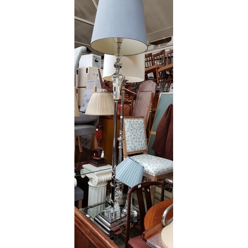 949 - A mixed lot comprising two modern standard lamps, glass table lamp, two glass top tables and an oak ... 