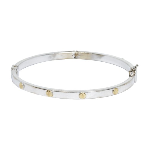 41 - A 9ct white gold Cartier style bangle, diameter approximately 58mm, gross weight 6.6g.