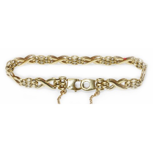 32 - A 9ct gold x and rice bead link bracelet, import marks, length 16cm, weight 11.8g.