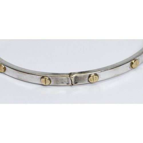 41 - A 9ct white gold Cartier style bangle, diameter approximately 58mm, gross weight 6.6g.