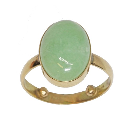 60 - A jadeite jade cabochon ring, the bezel set cabochon measuring approximately 16mm x 6mm, yellow band... 