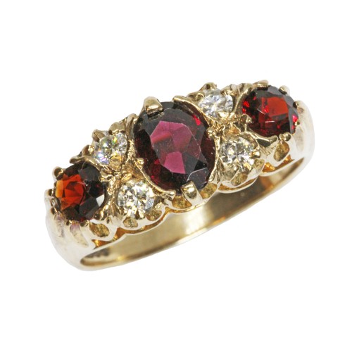 54 - A hallmarked 9ct gold garnet and diamond ring, sponsor 'FM' (Fred Manshaw Ltd), London 1967, gross w... 