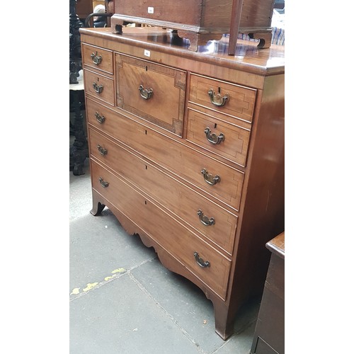 988 - A 19th century inlaid mahogany chest of drawers on splayed bracket feet.