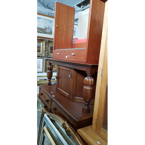 982 - An oak court cupboard and a modern side table with glass shelf.