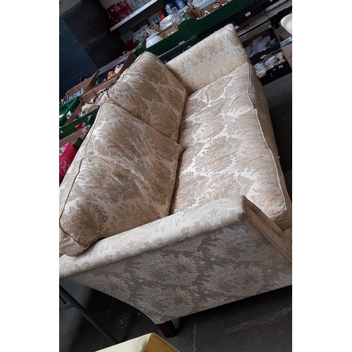 1005 - A Duresta three seater sofa upholstered in cream and gold damask.