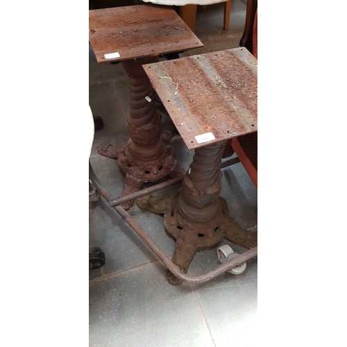 996 - A pair of cast iron table bases, height 69cm.