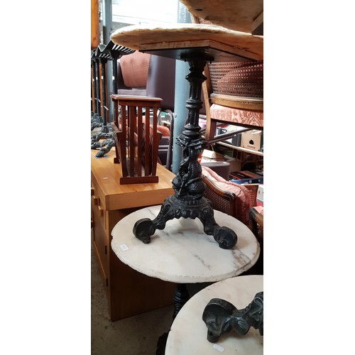 995 - A pair of cast iron and marble top tables, height 72cm & diameter 61cm.