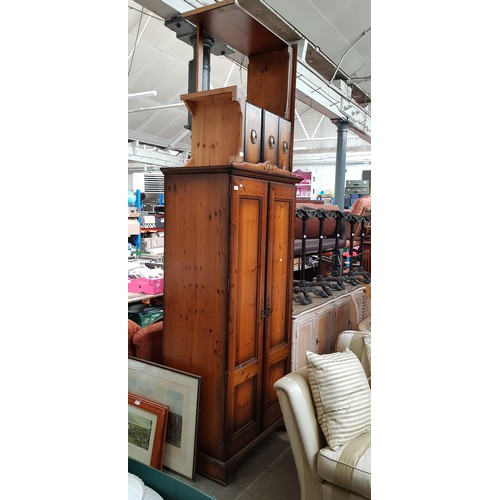 1012 - A stained pine wardrobe, desk and headboard.