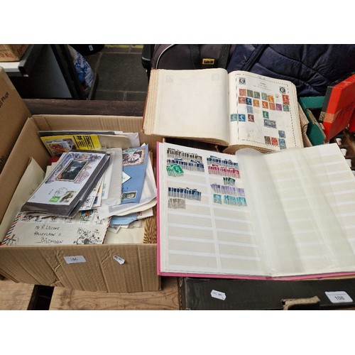 106 - 2 boxes of stamp albums and first day covers