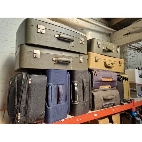 134 - 11 various suitcases, vintage and modern