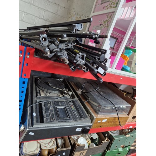 135 - Two vintage record players and a selection of tripods.