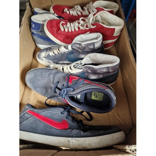 177 - A box containing 4 pairs of vintage Nike shoes