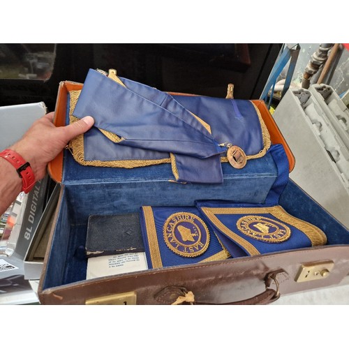 228 - A case containing Masonic regalia and a box of 78s.