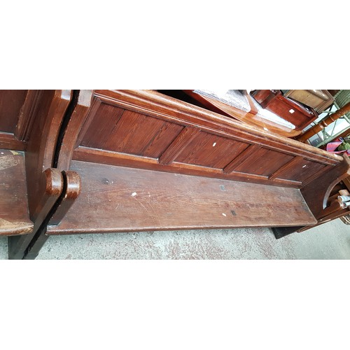 953 - A pitch pine church pew, length 212cm.