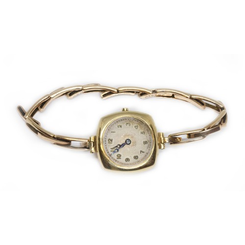 80 - A ladies  9ct gold wristwatch with strap marked '9ct', gross weight 16.1g.