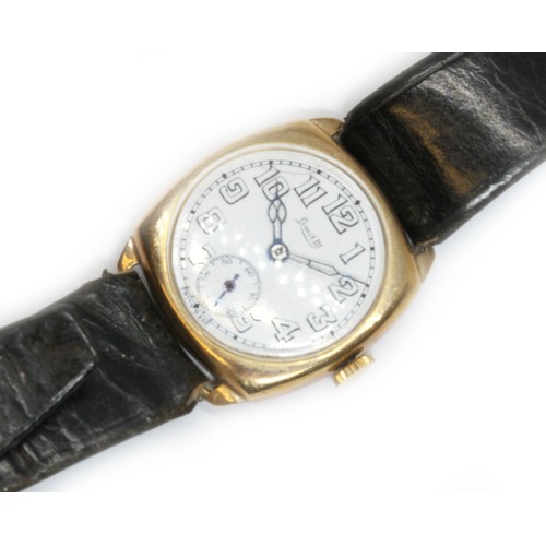 87 - A 9ct gold cased Limit III wristwatch with leather strap, case width 27mm.