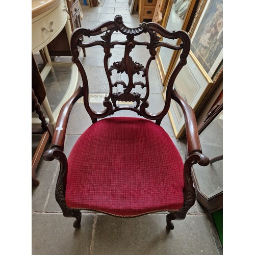 970 - An Edwardian mahogany salon suite comprising settee and two armchairs.