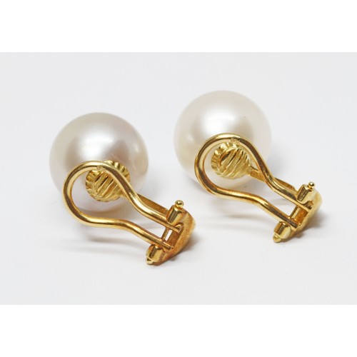 114 - A pair of cultured pearl earrings, each pearl measuring approximately 11.75mm in diameter, yellow me... 