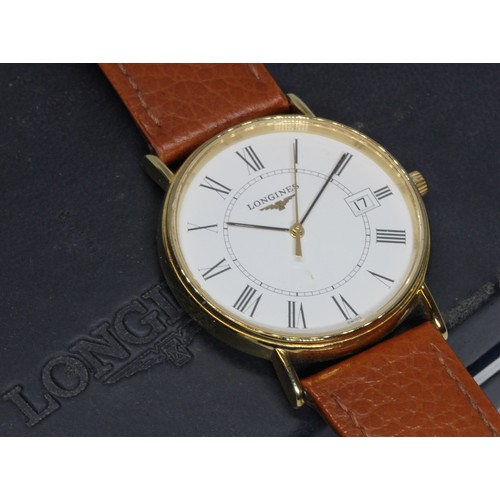 99 - A gent's gold plated Longines quartz wristwatch, case diameter 34mm, with box and papers.