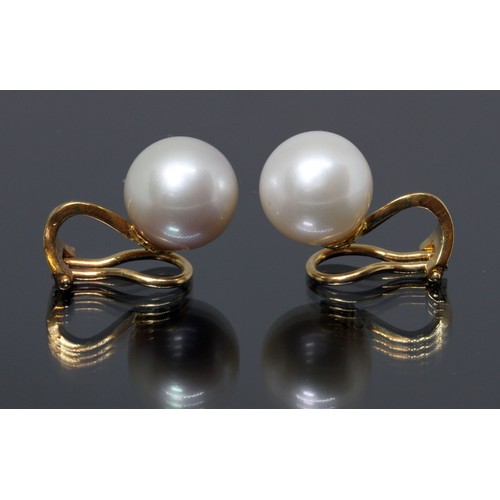 114 - A pair of cultured pearl earrings, each pearl measuring approximately 11.75mm in diameter, yellow me... 