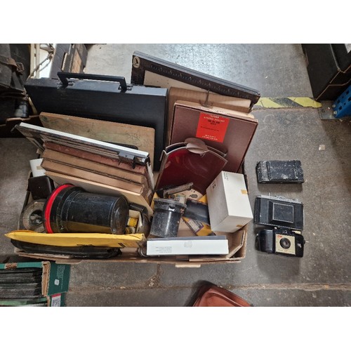 149 - 4 boxes of photographic equipment and darkroom accessories, including plate camera