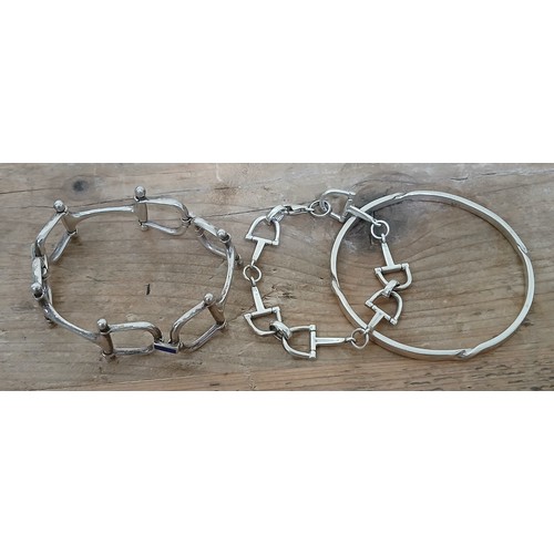 126 - Two equestrian themed bracelets: one modelled as linked horse bits and the other linked stirrups, to... 