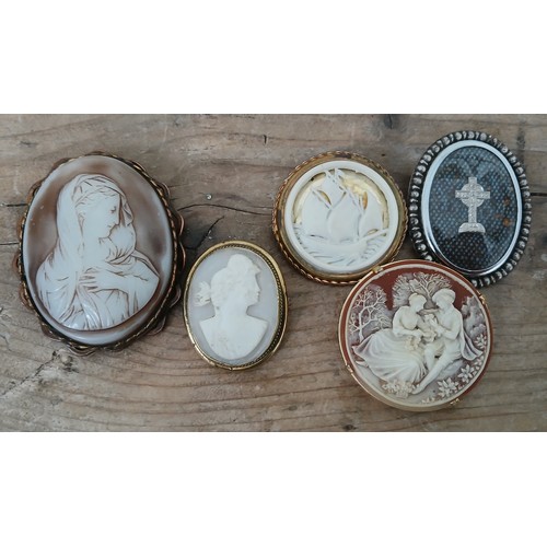 138 - Two antique cameo brooches and three others.