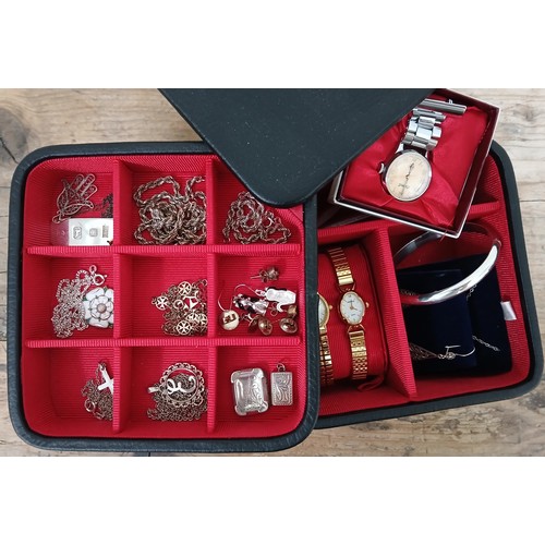 163 - A jewellery box containing mainly silver jewellery.