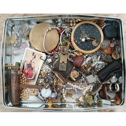 144 - A tin of costume jewellery and collectables including silver.