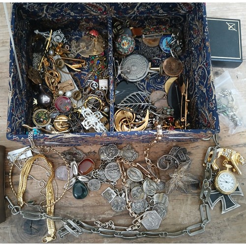 145 - A jewellery box containing costume jewellery, vintage brooches and silver.