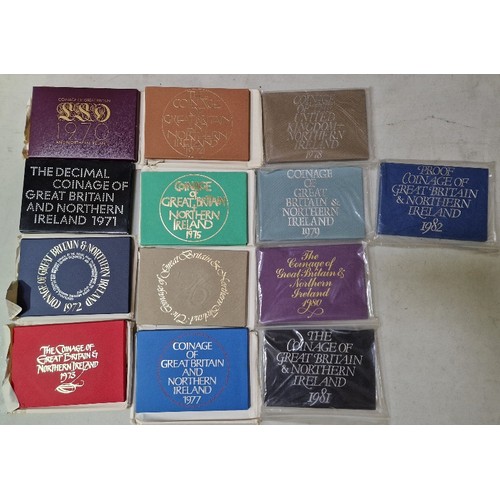 274 - A collection of thirteen Royal Mint annual coin sets, 1970 to 1982.