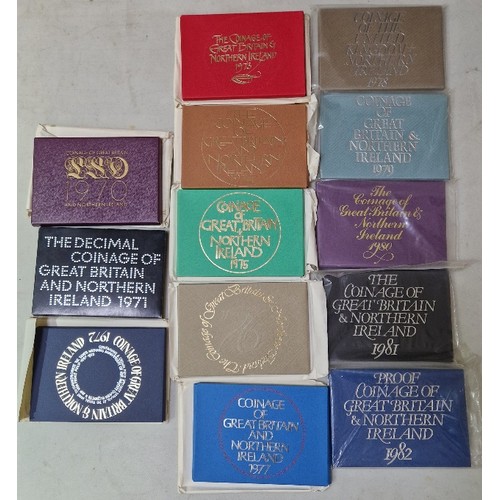 275 - A collection of thirteen Royal Mint annual coin sets, 1970 to 1982.