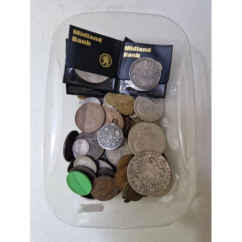 289 - A tub of assorted GB & world coins to include a 1780 restrike thaler, commemorative crowns & some si... 