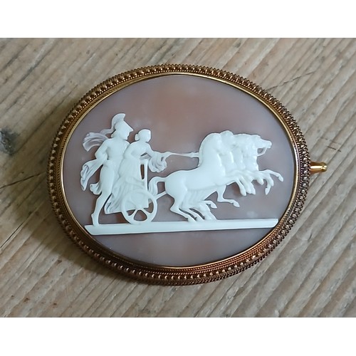 228 - A Victorian yellow mounted cameo brooch, 70mm x 55mm, unmarked, gross weight 31g.