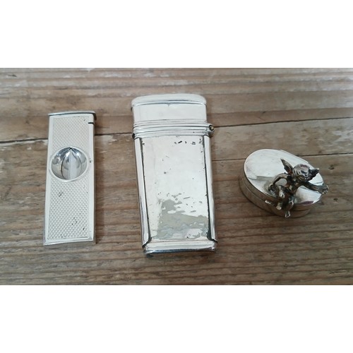 225 - A mixed lot of hallmarked silver comprising a vesta case, a cigar cutter and a tooth fairy box.