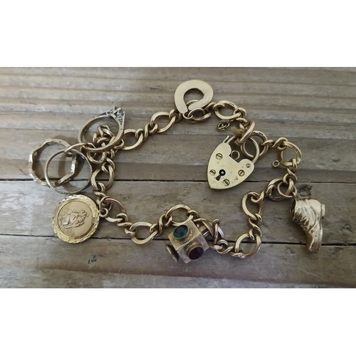 231 - A charm bracelet, various charms including three hallmarked 9ct gold, one unmarked and another marke... 