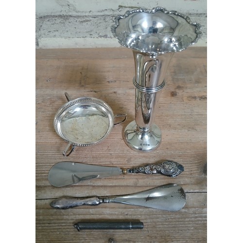 190 - A mixed lot of hallmarked silver comprising a vase, a small dish, two silver handled shoe horns and ... 