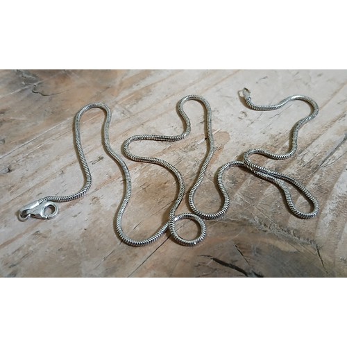 251 - A smooth snake link chain with lobster claw clasp marked '750', length 45cm, weight 4.7g.