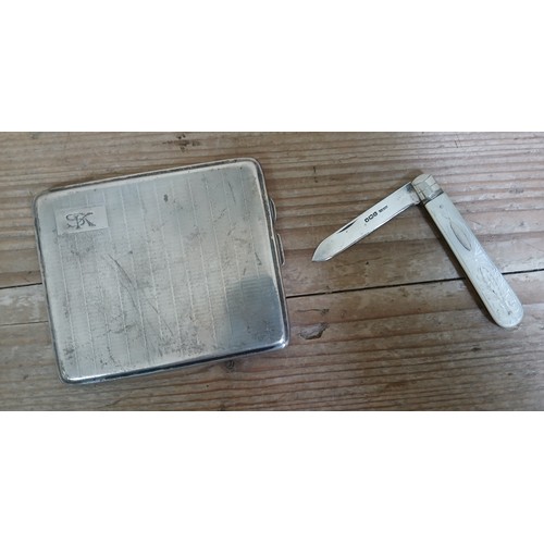 199 - A hallmarked silver cigarette case, weight 4ozt, and a silver and mother of pearl fruit knife.