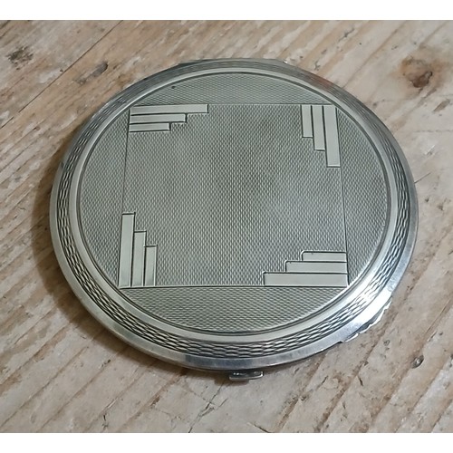 258 - An Art Deco hallmarked silver compact, diameter 8.5cm.